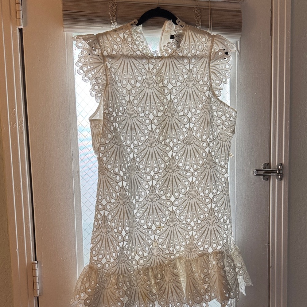 White Lace Eyelet Sleeveless Dress with Ruffle Hem.
